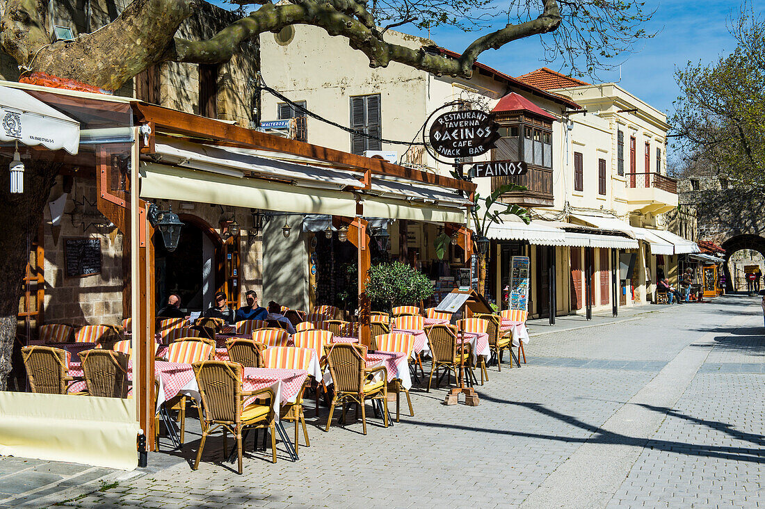 Street cafe in the Medieval Old Town, UNESCO World Heritage Site, City of Rhodes, Rhodes, Dodecanese Islands, Greek Islands, Greece, Europe