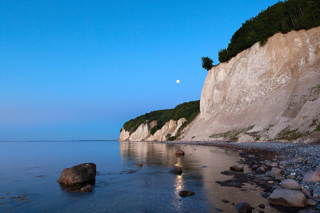 Full moon over the chalk cliff, National Park Jasmund, Ruegen island, Baltic Sea, Mecklenburg-West Pomerania, Germany