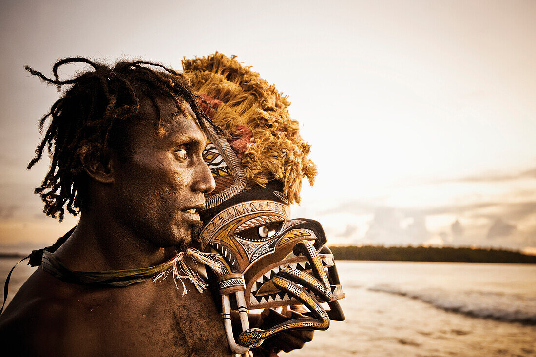 Islander with Malagan mask, New Ireland, Papua New Guinea