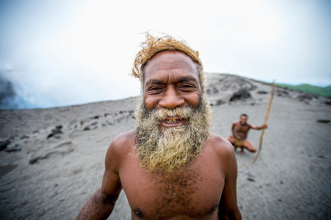 A local landowner standing at the rim of Yasur Volcano, Tanna Island, Vanuatu