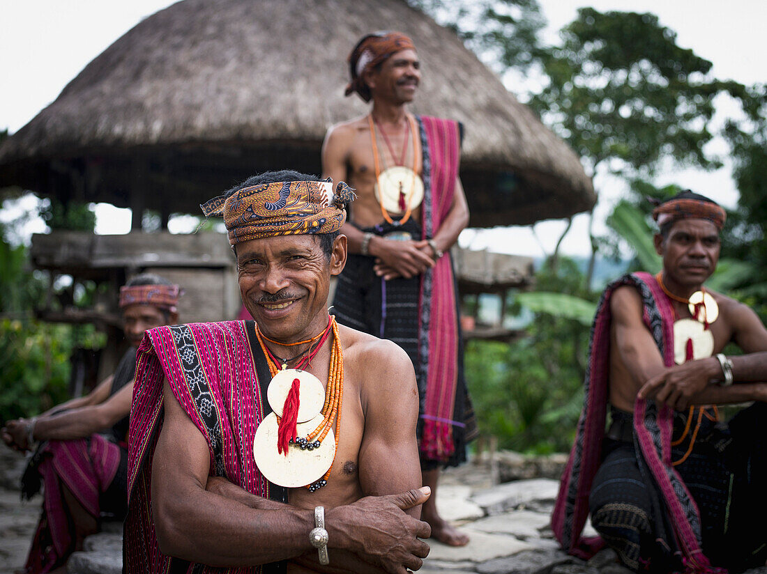 Timorese men in traditional attire at Liurai Village, Timor-Leste
