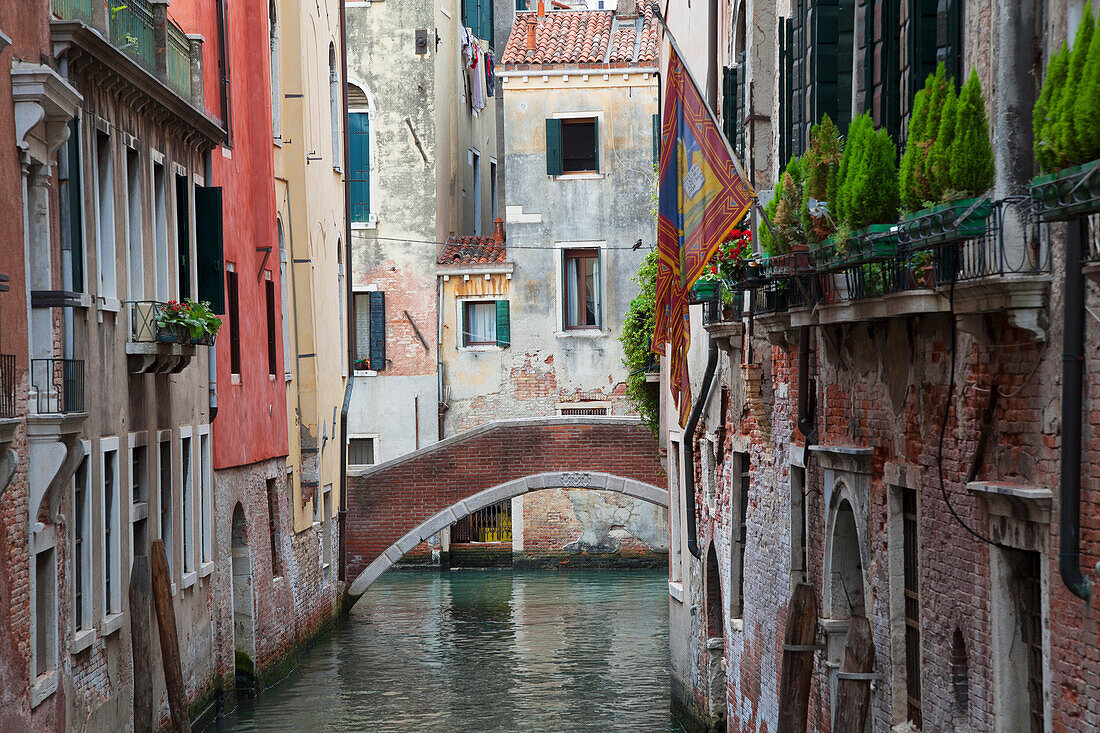 A quaint bridge over a narrow canal, Venice, Italy