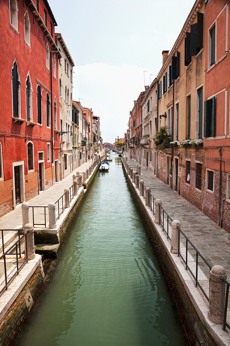 A narrow canal lined with residential buildings, Venice, Italy