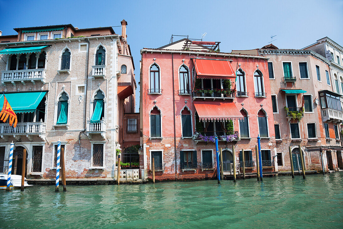 Colourful rustic buildings, along the Grand Canal, Venice, Italy