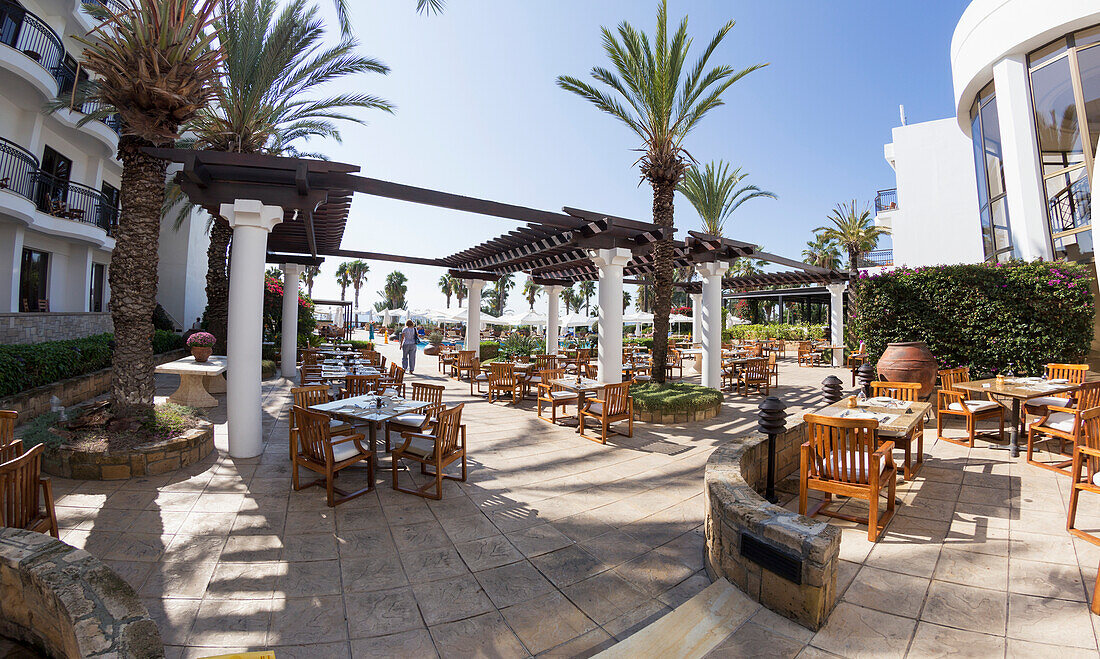 Seating on a patio with palm trees, Paphos, Cyprus