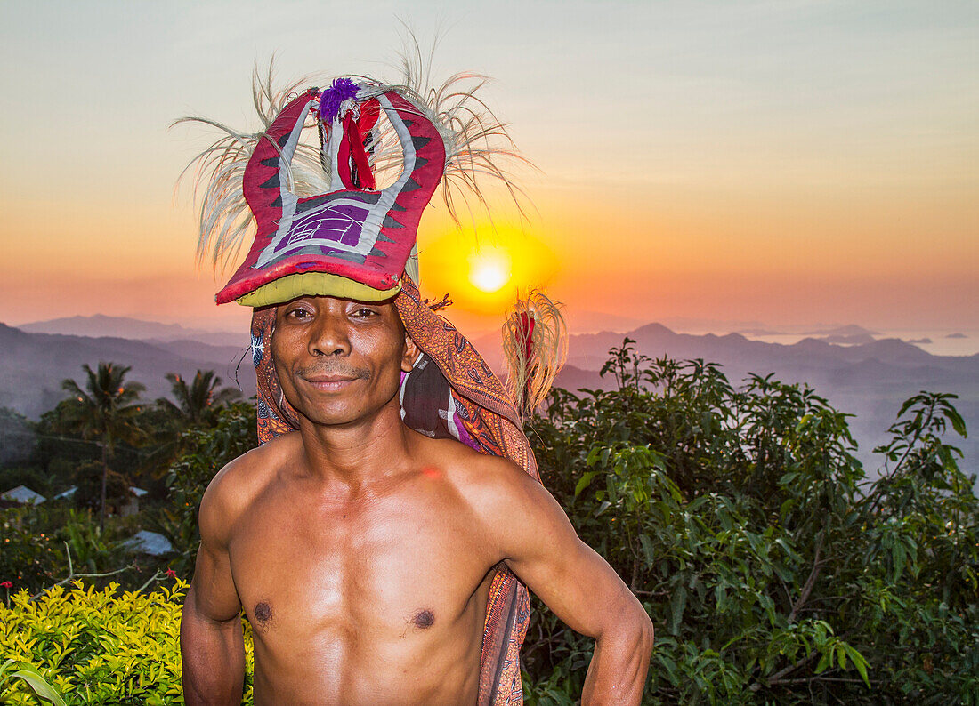 Manggarai man wearing a traditional headdress wrapped with cloth used in caci, a ritual whip fight, Melo village, Flores, East Nusa Tenggara, Indonesia