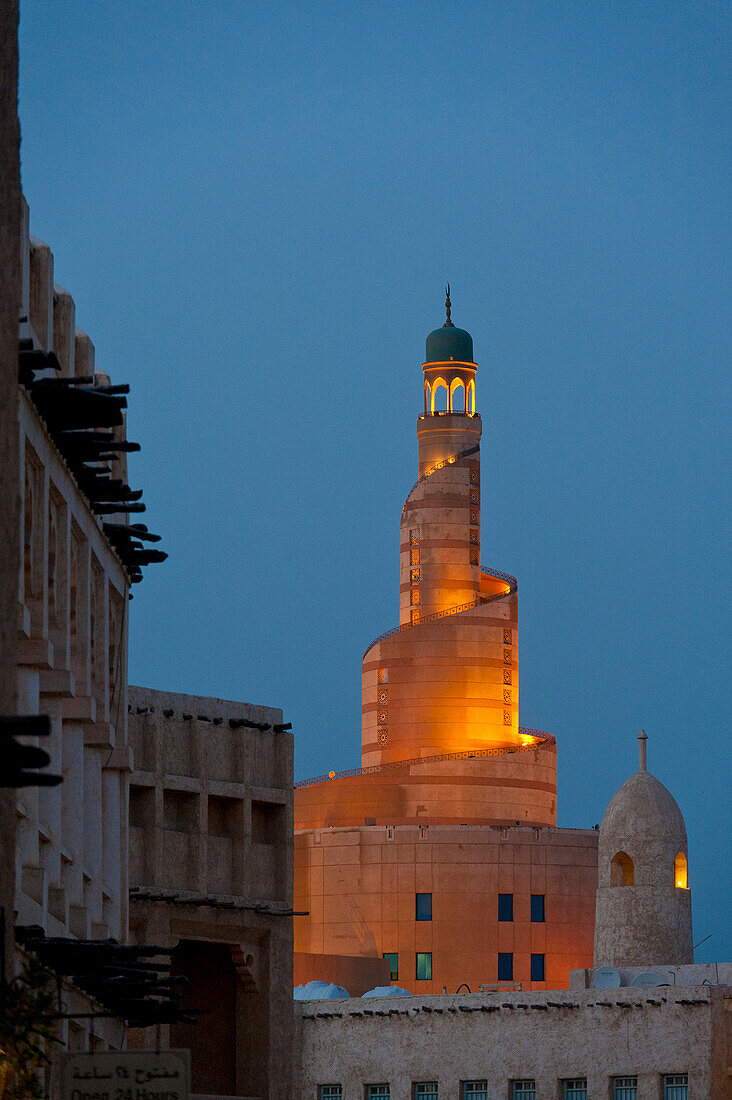 Looking over the Wafi souk to Qatar Islamic Culture Center and Mosque (Fanar) at dusk, Doha, Qatar