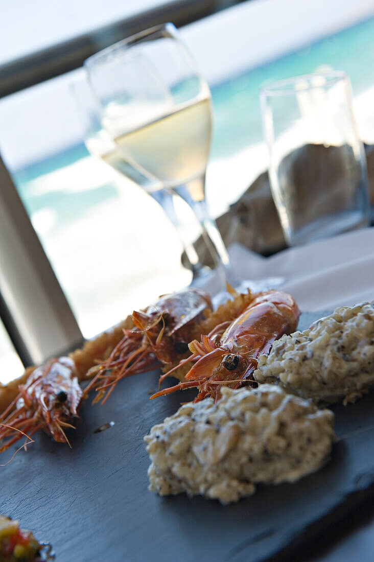 Seafood lunch at Restaurant Marinella. Located on the seafront at L'iIle Rousse. La Balagne. Corsica. France