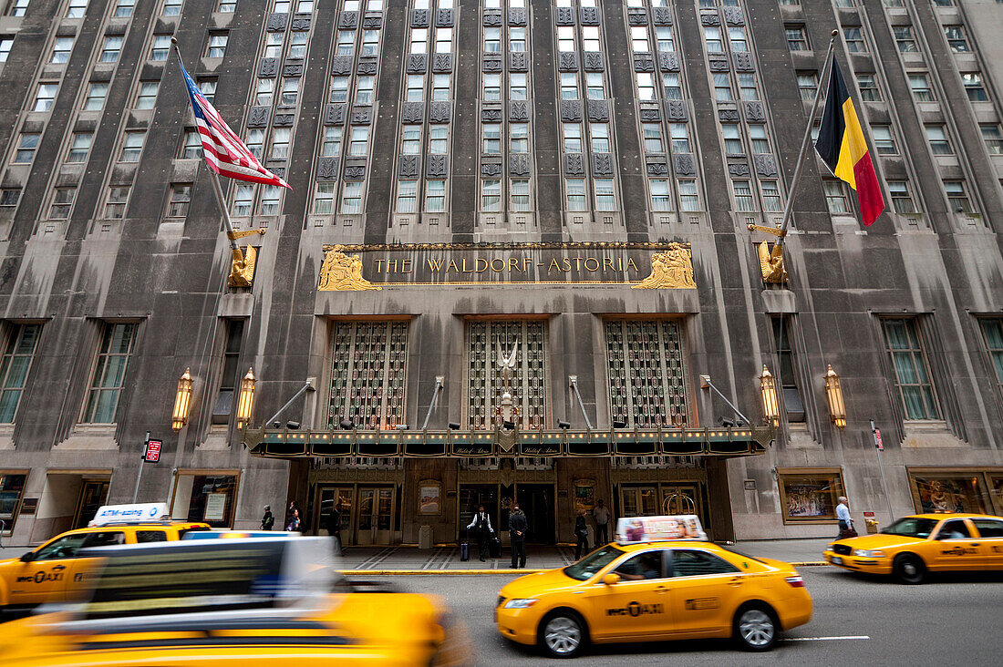Taxis Passing By The Waldorf Astoria Hotel In Midtown Manhattan, New York, Usa