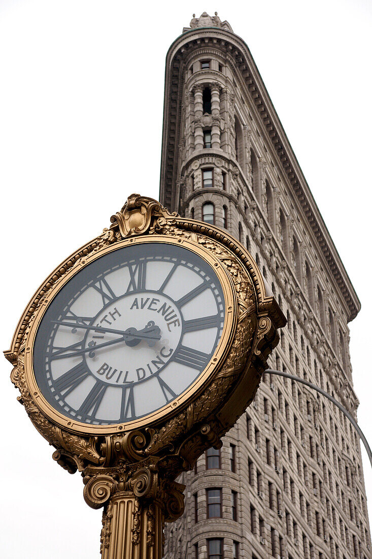 The iconic Flatiron Building and the 5th Avenue Clock, Midtown Manhattan, New York City, New York, United States of America