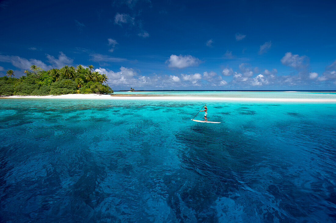 Paddle boarding by a remote atoll of the Marshall Islands, Marshall Islands