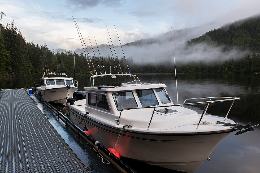 'Fishing boats along a dock; Queen Charlotte Islands, British Columbia, Canada'