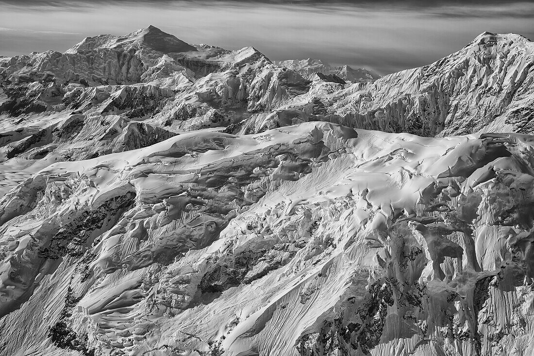 'Black and white aerial view of the mountains and icefields in Kluane National Park; Yukon, Canada'