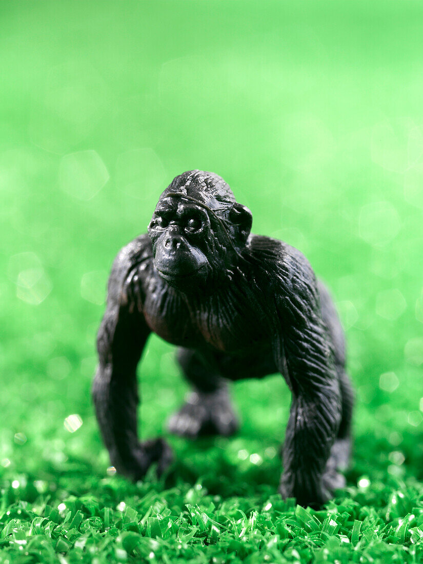 Close Up Of Miniature Toy Gorilla On Artificial Grass