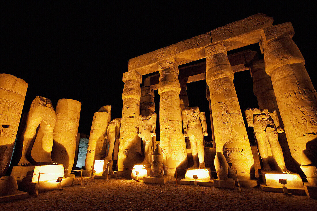 Columns And Monumental Statues In The Courtyard Of Ramses Ii Of The Luxor Temple At Night, Luxor, Qina, Egypt