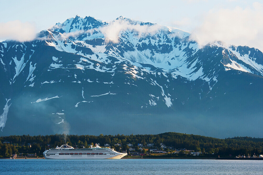 Scenic view of a cruise ship moored at Haines with coastal mountains in the background, Inside Passage, Southeast Alaska