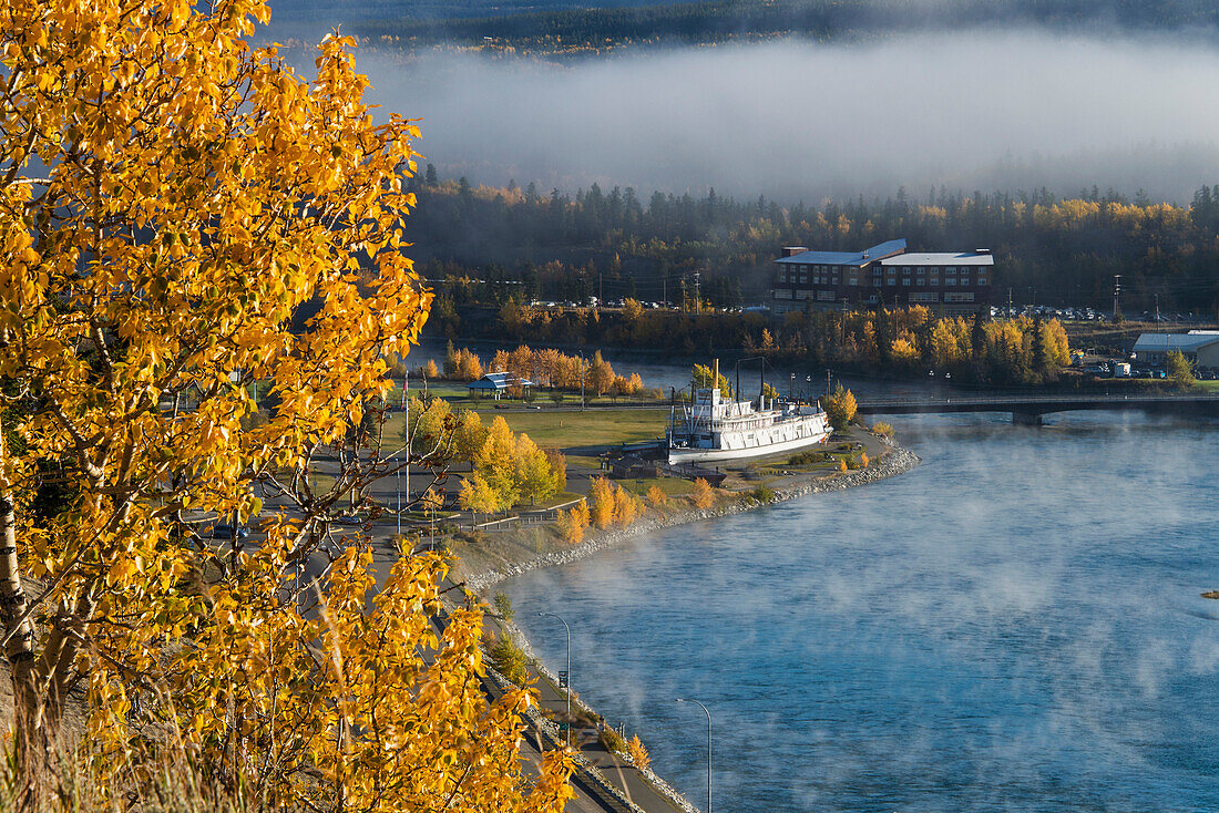 Fog hangs over the Yukon River and the SS Klondike riverboat, Whitehorse, Yukon Territory, Canada
