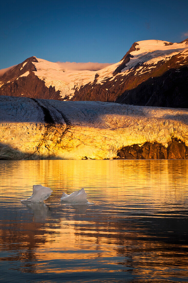 Sunrise view of Portage Glacier with icebergs and Byron Peak in the background, Chugach National Forest, Kenai Peninsula, Southcentral Alaska, Summer.