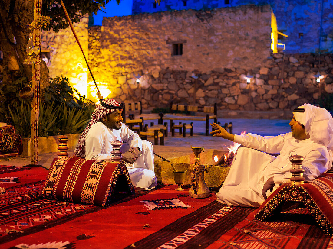 Men sitting, relaxing and talking, Abha, Saudi Arabia