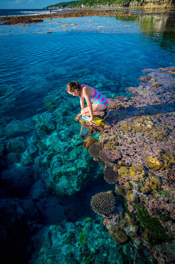 Exploring the reef that rings Niue Island, Niue
