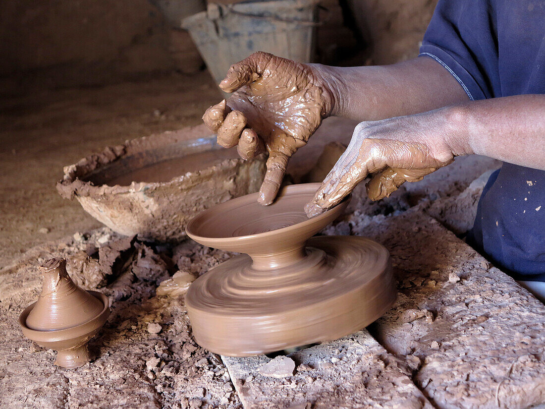 Morocco, Draa Valley, Tamegroute, Crafts, Potter working on his turn