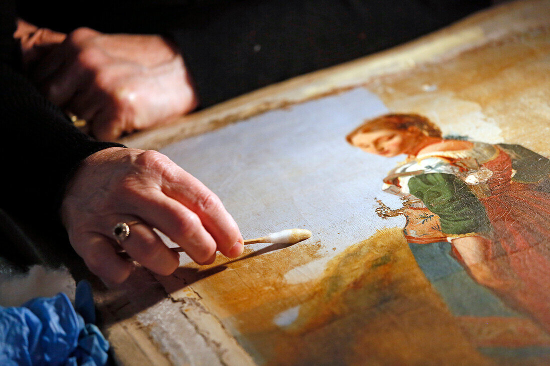 France,Seine et Marne, Blandy les Tours, Crafts, Restoration of paintings, Close up of a quilter trying to clean an old painting