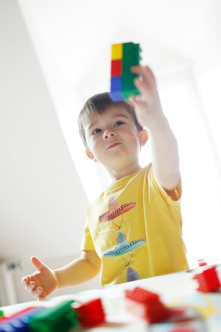 A boy playing with Lego