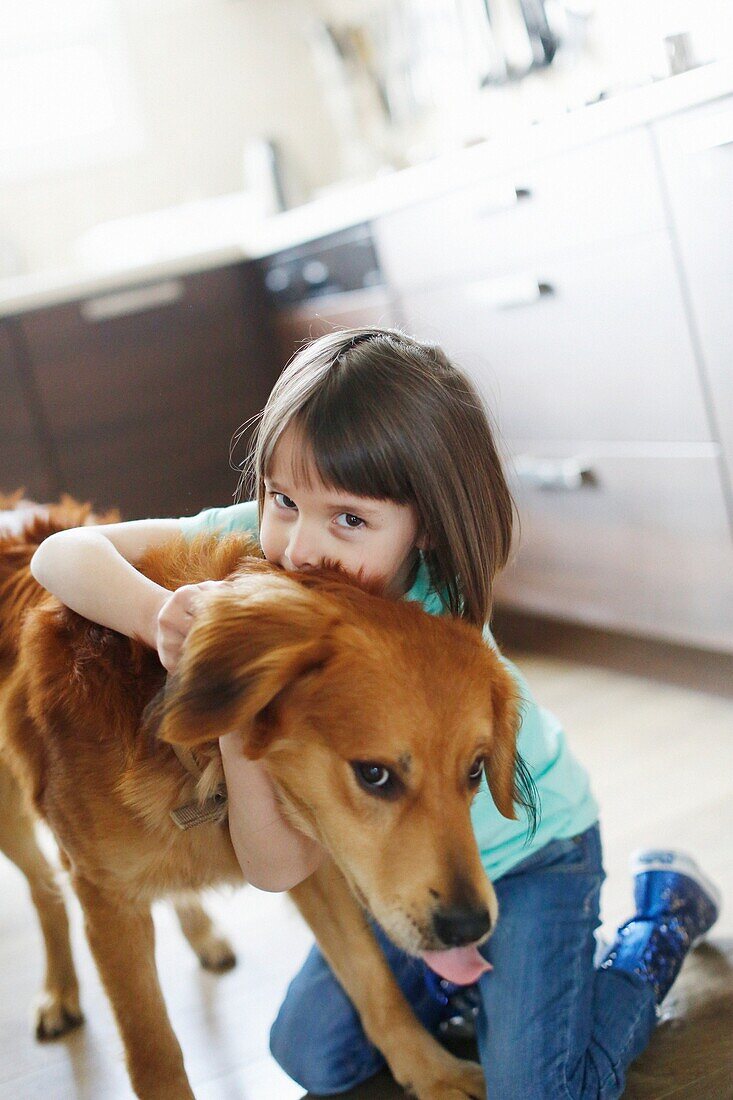 Girl playing with a dog
