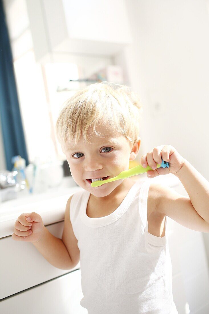 Little boy brushing his teeth