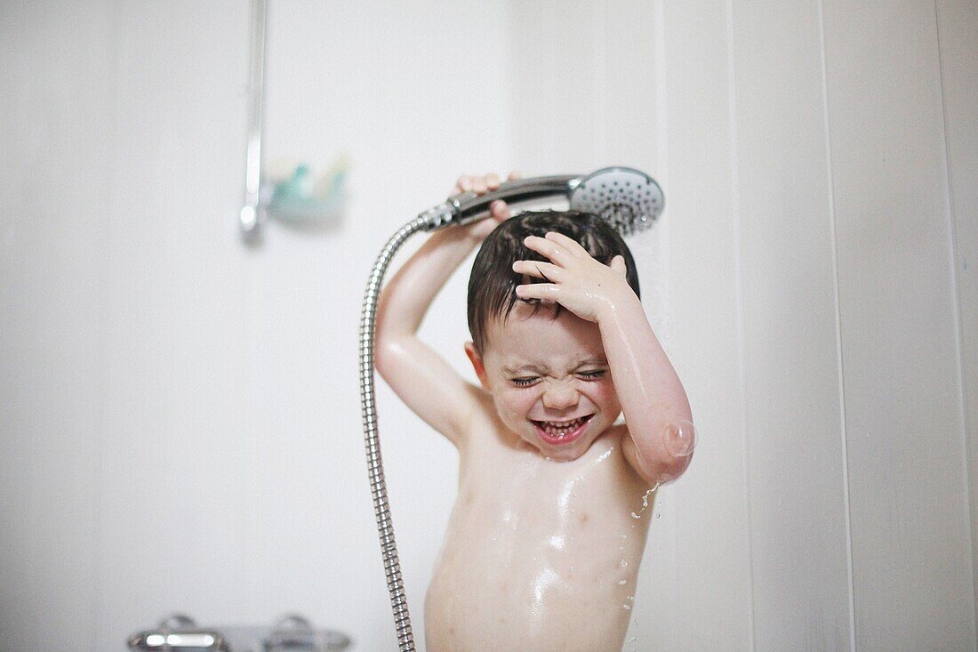 Little boy taking a bath