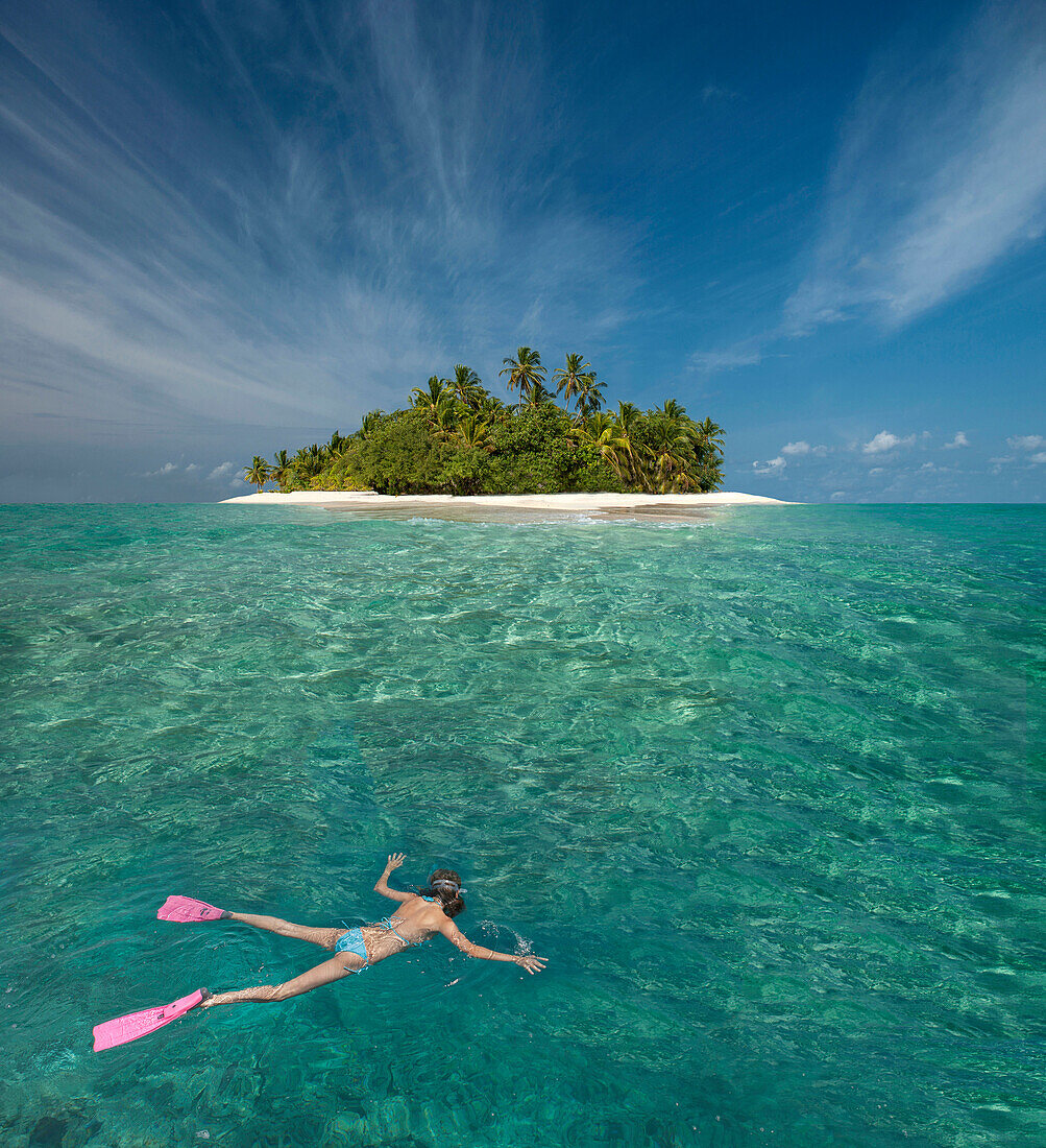 Caucasian woman snorkeling off tropical island