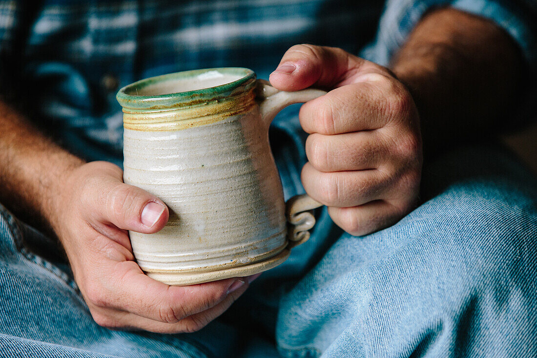 Man Holding Ceramic Cup