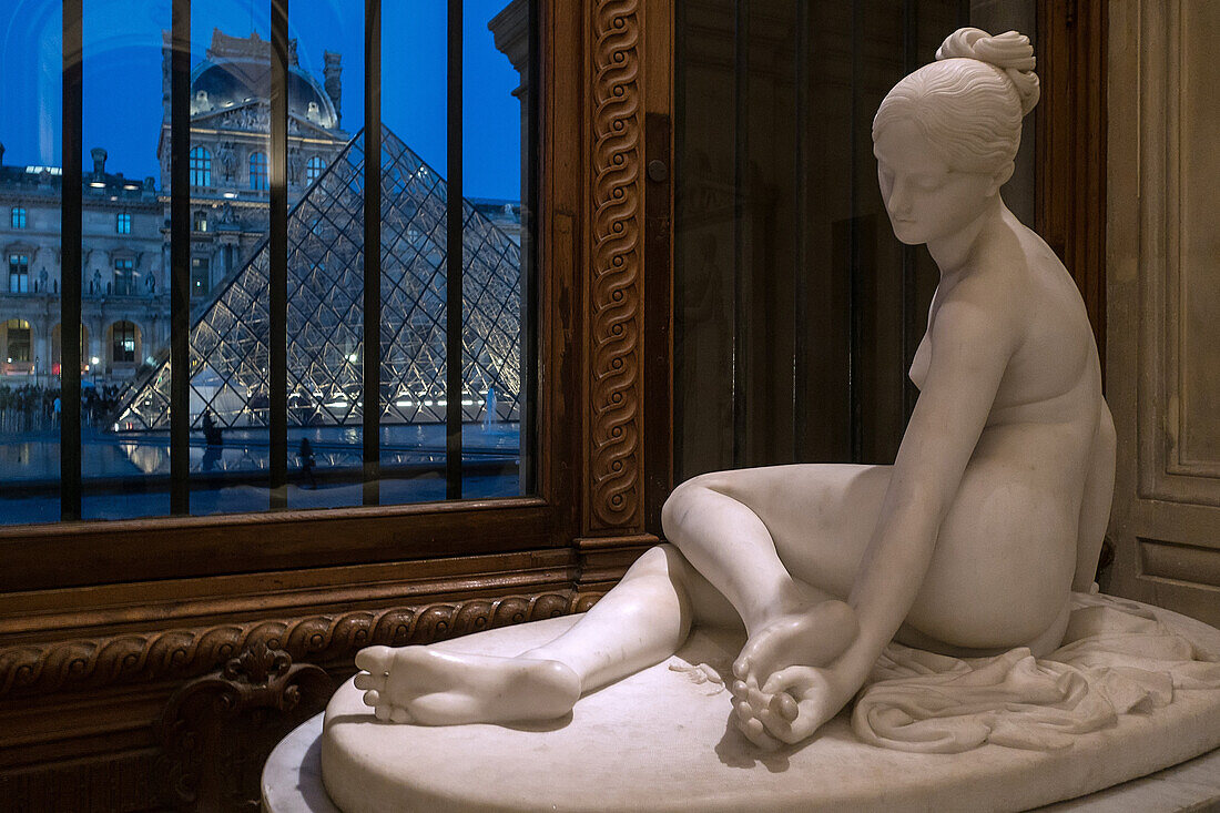 the nymph with the scorpion by lorenzo bartolini, hall of italian sculptures, marble sculpture in front of the facade and pyramid of the museum of the louvre, paris (75), france