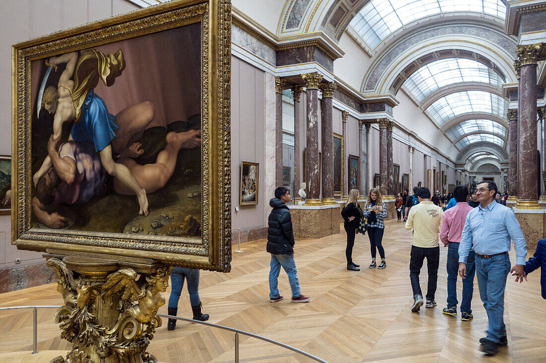 visitors in the hall of italian paintings, museum of the louvre, paris (75), france