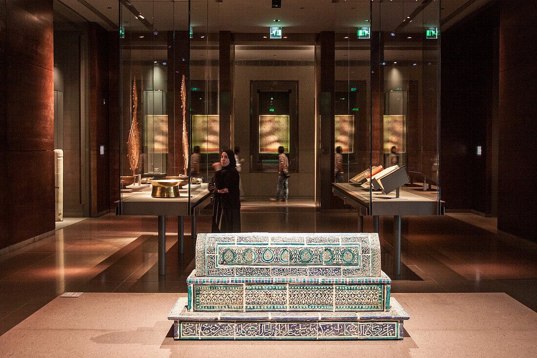 muslim tomb and display cases in one of the galleries of the museum of islamic art, doha, qatar, persian gulf, middle east