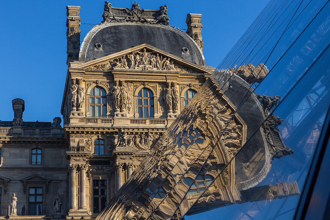 the louvre and its pyramid, situated in the heart of the city in the 1st arrondissement, it is one of the biggest museums in the world and the biggest in france, (75) paris, ile-de-france, france