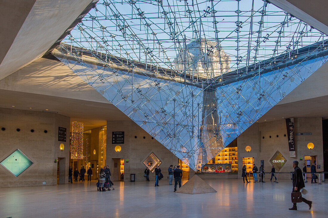 the carrousel du louvre and its inverted pyramid, situated below the tuileries gardens, is both a shopping mall and cultural and historical space, (75) paris, ile-de-france, france