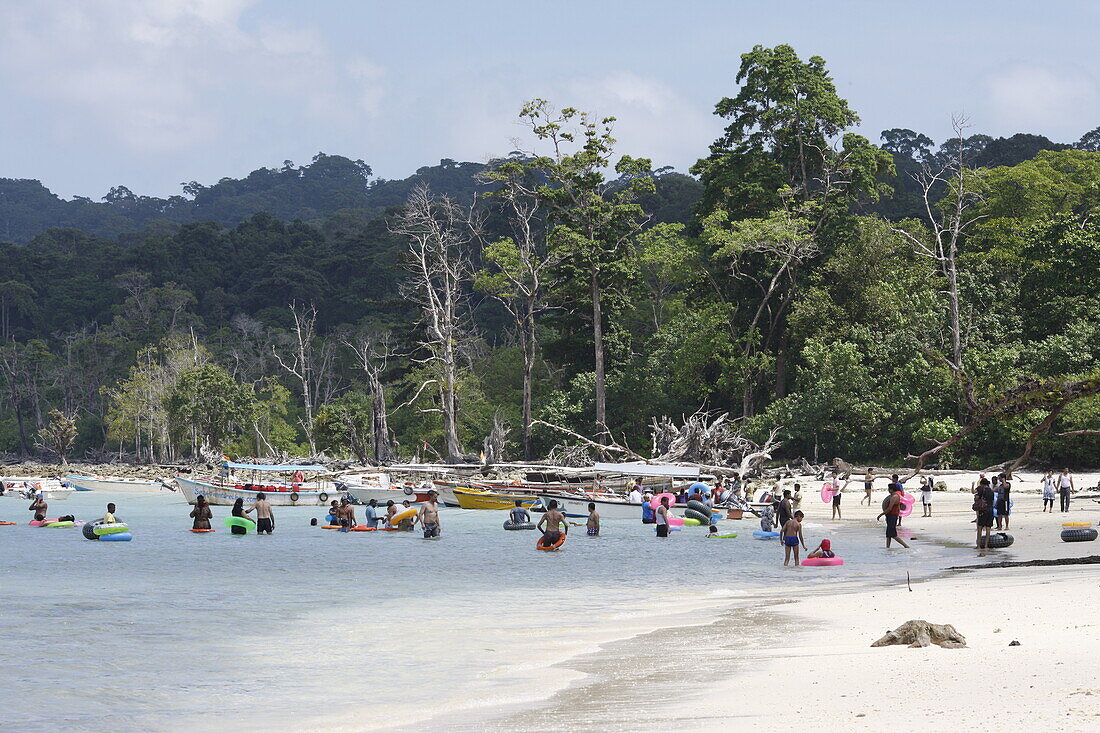 Elephant Beach, Indian tourists at the most crowded beach on the island, shallow water, many non-swimmers, coastal forest without palms, northwest coast, Havelock Island, Andaman Islands, Union Territory, India