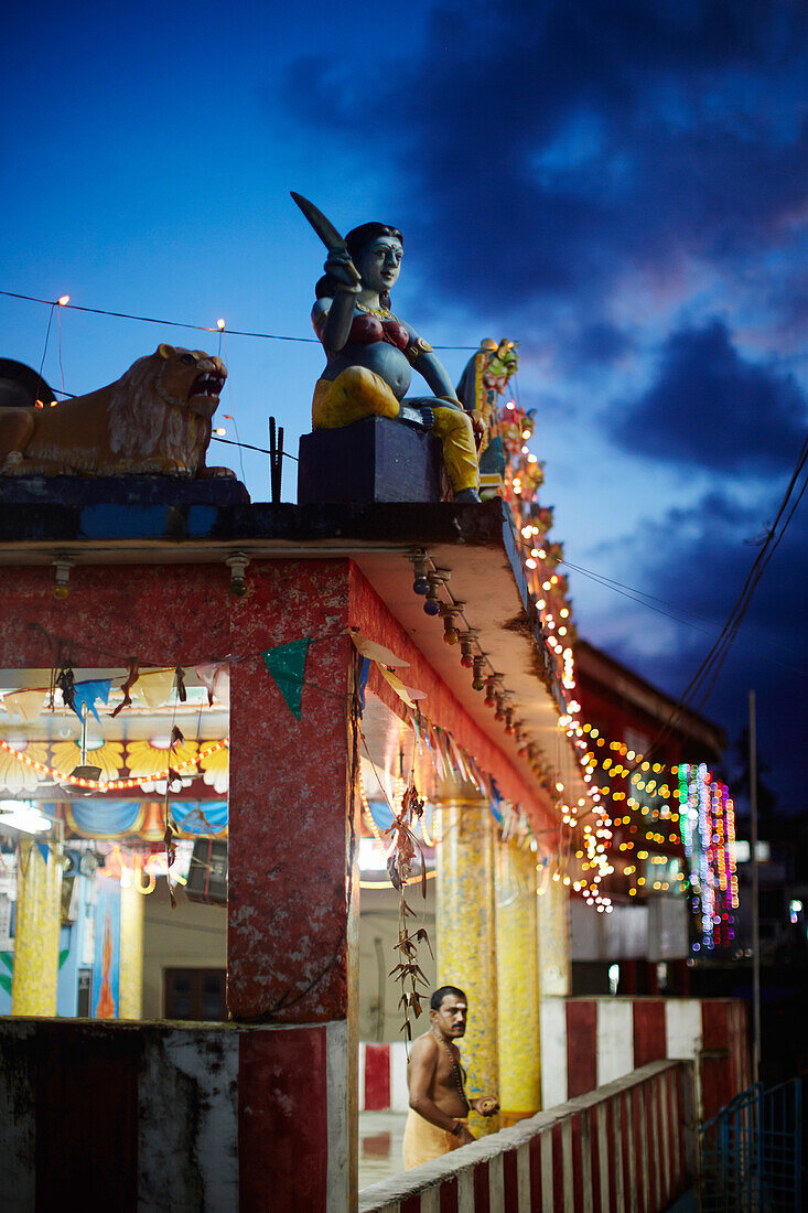 Decorated Hindu temple on Main Street Subhas Bazaar in the evening, priests, Diwali Festival of Lights on 02/11/13, large village Diglipur, North Andaman, Andaman Islands, Union Territory, India