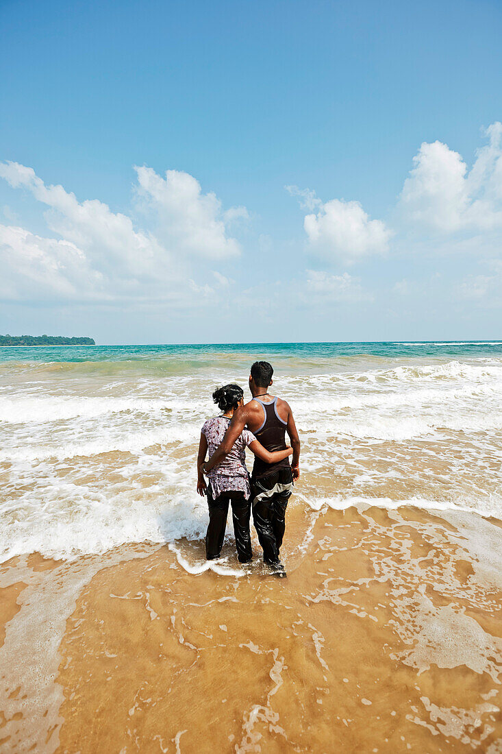 Couple in the water, Butler Bay Beach, uninhabited, East Coast, northern Can Hat Bay, Little Andaman, Andaman Islands, Union Territory, India