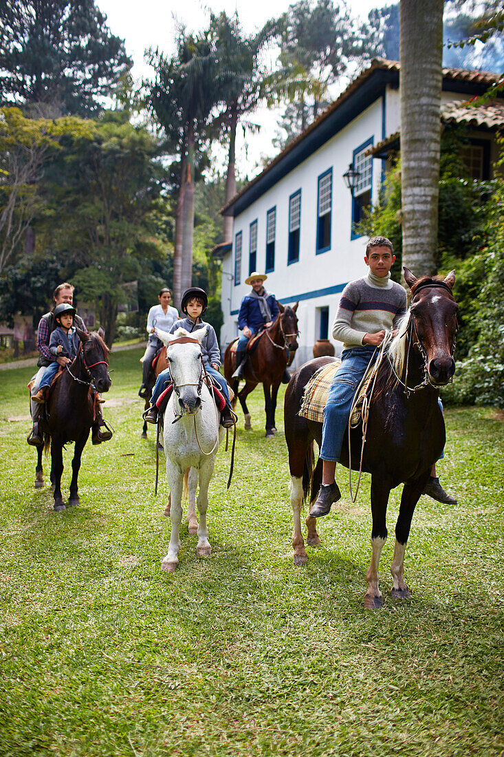 Horse riding for guests of Fazenda Catucaba, old farm from 1850 is now also a luxurious hotel, located in the coastal mountains, Parque Serra do Mar in Sao Luiz do Paraitinga, Sao Paulo, Brazil