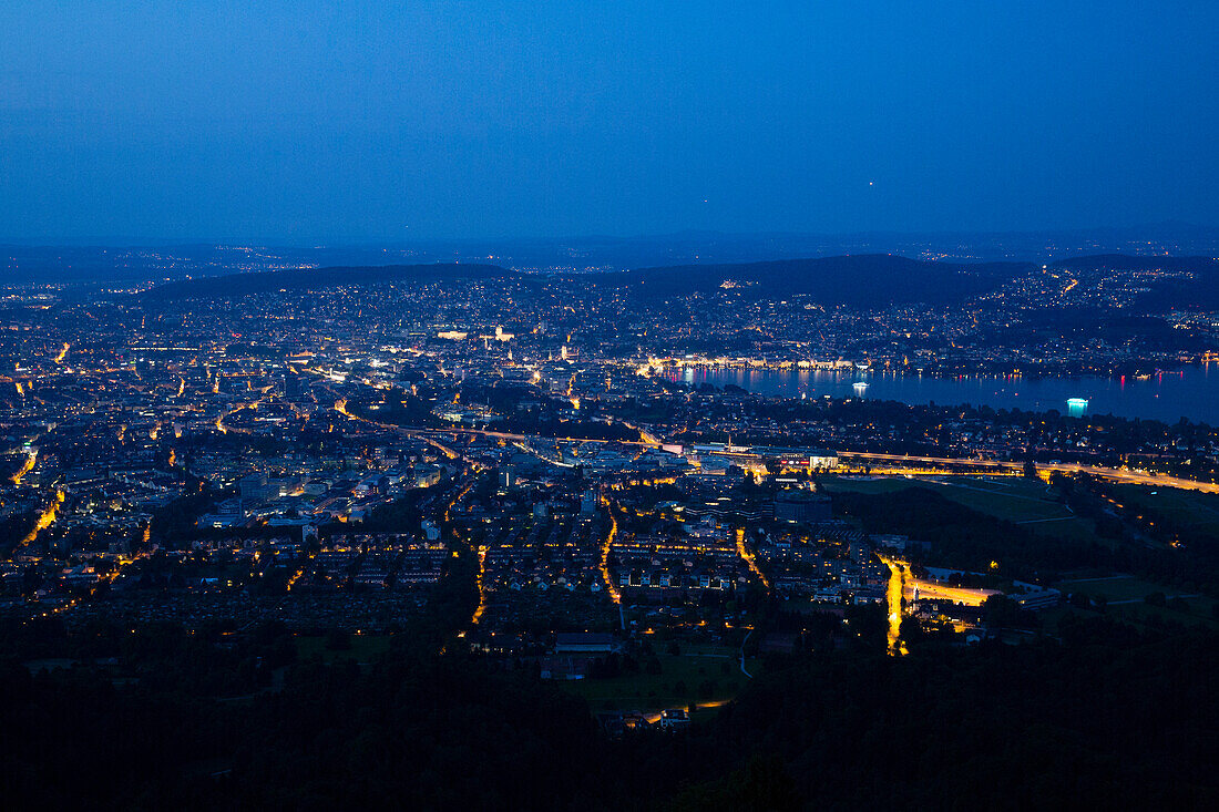 Full moon over lake Zurich and Zurich at night, Zurich, Switzerland