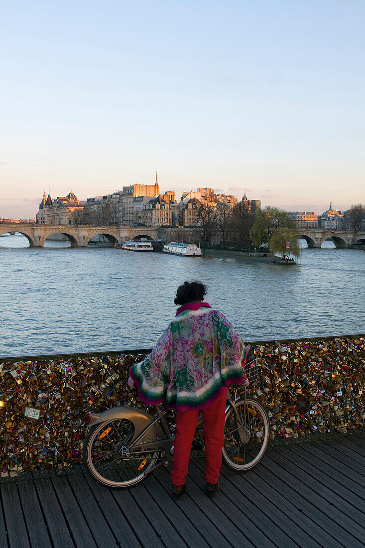 France, Paris, 75, 1st ARRT, Pont des Arts, woman with a Velib'