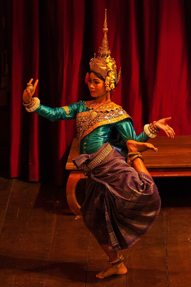 Camdodia, Siem Reap Province, Siem Reap Town, the Apsara Theatre, an Apsara dancer performs on stage Khmer traditional dances