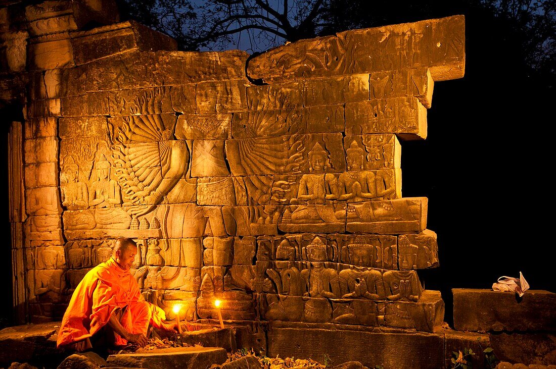 Camdodia, Banteay Mean Chey Province, Banteay Chhmar temples, Site World Heritage of Humanity by Unesco in 1992, Banteay Chhmar temple, the monk Chean Som praying in front of Avalokiteshvara, a major character of Buddhism