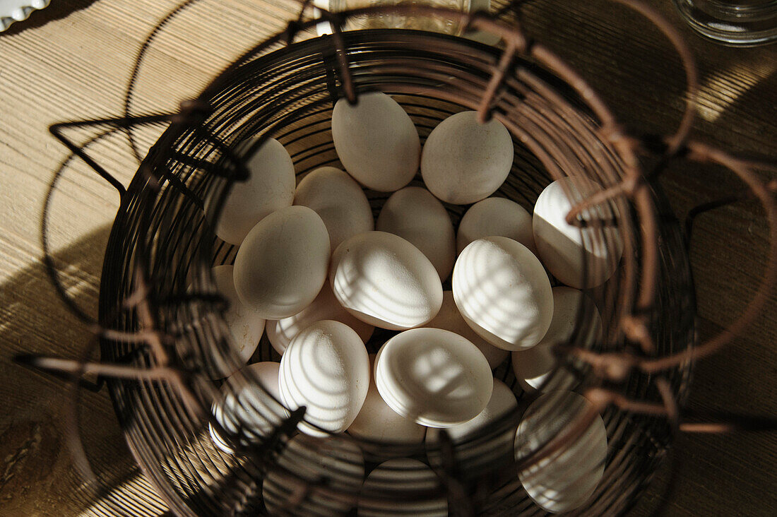 Close up of wire basket of eggs