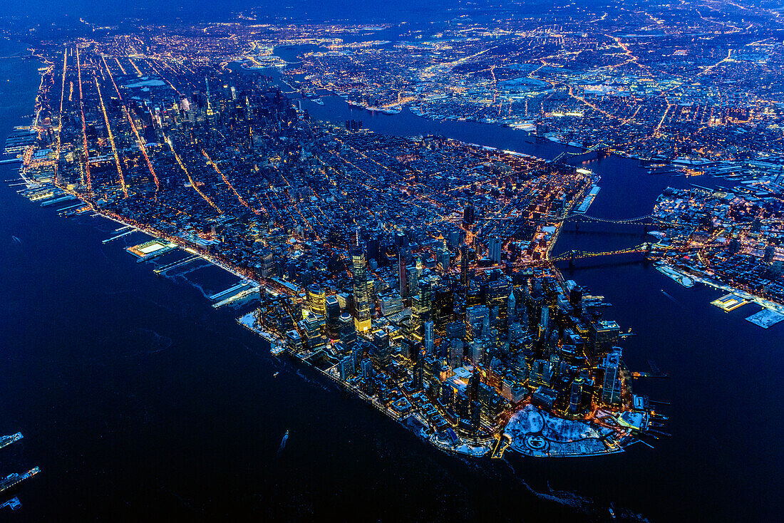 Aerial view of Manhattan cityscape and river at night, New York, United States