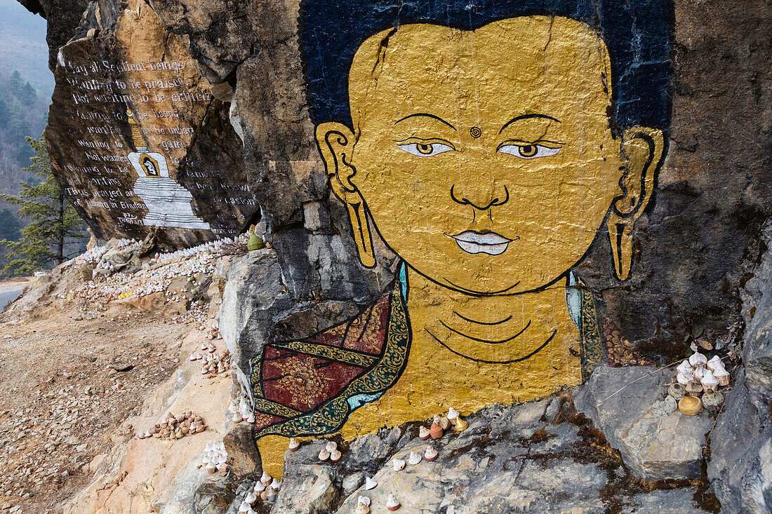 Close up of Buddha painting on rock formation, Chazam, Trongsa District, Bhutan