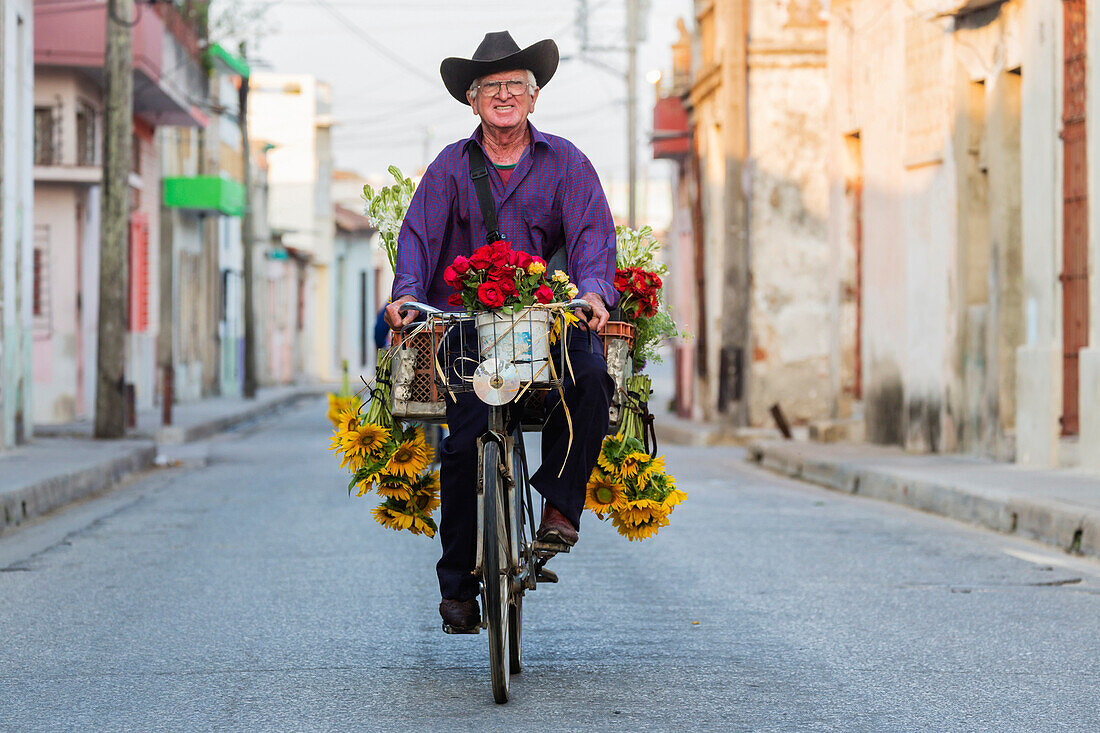 Hispanic florist riding bicycle