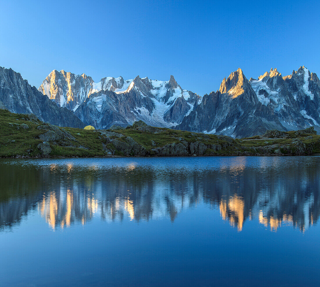 Grandes Jorasses and Dent du Geant reflected at sunrise in Lac des Cheserys, Haute Savoie, French Alps, France, Europe
